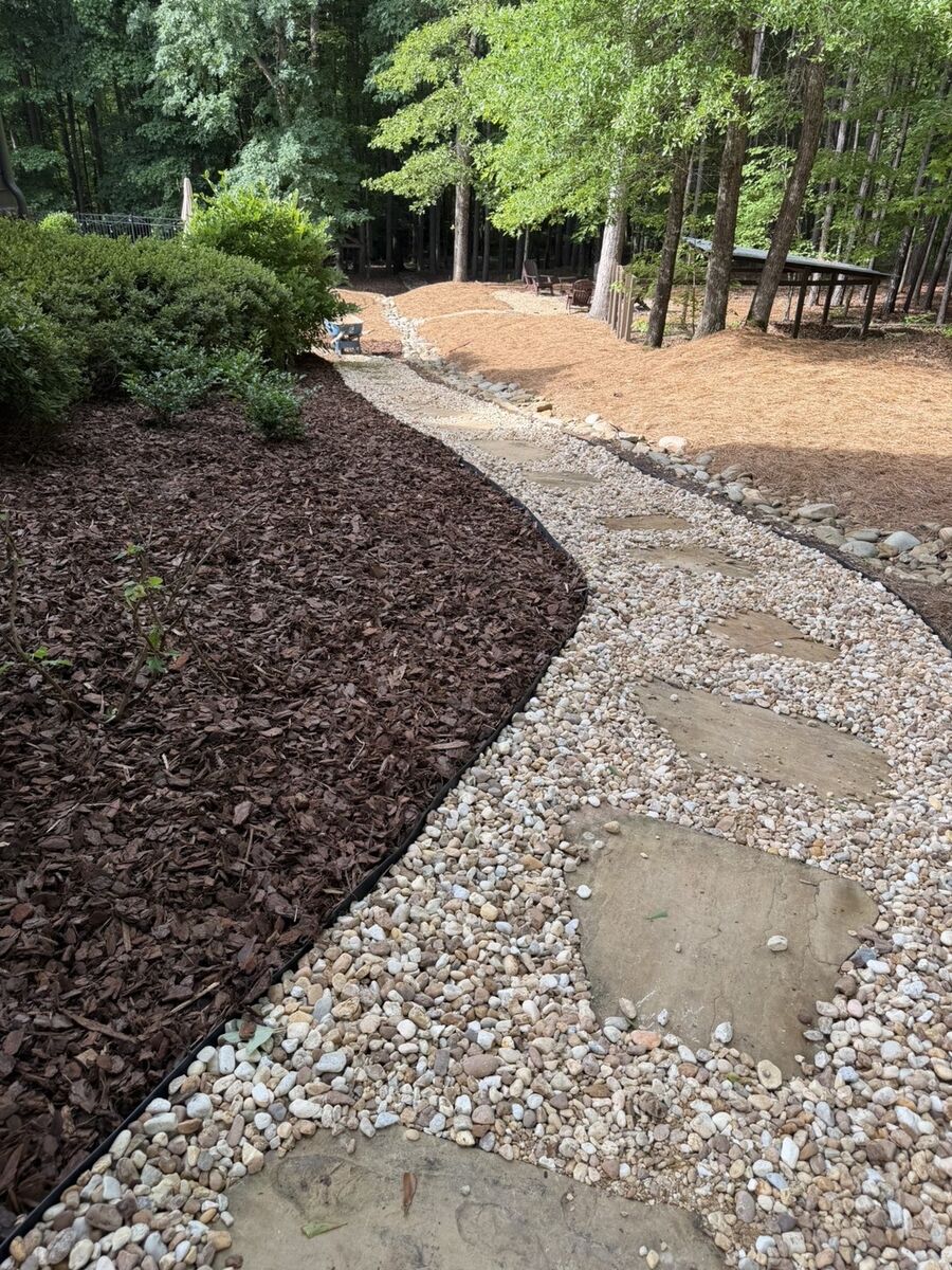 Curved stone path with mulch border